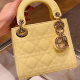Styled lifestyle shot of structured signature women's handbag – women's designer-style accessory