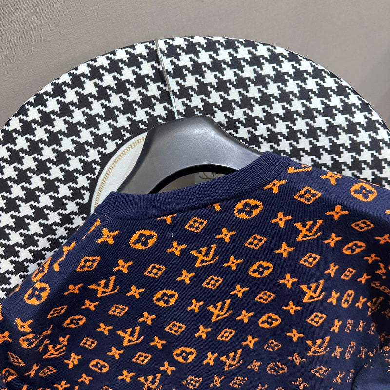 Full styled look of Louis Vuitton luxury clothing with label-forward styling