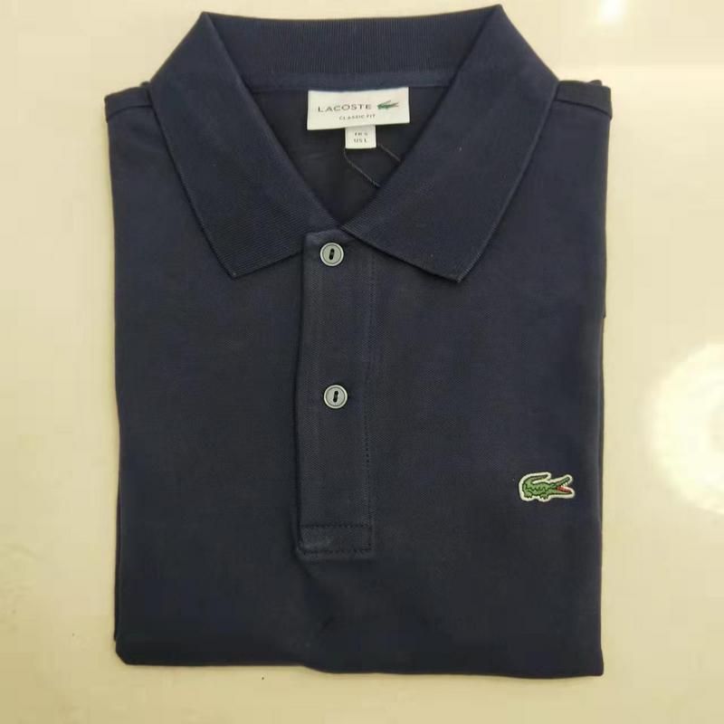 Side profile of Lacoste luxury clothing with monogram-inspired silhouette