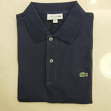Side profile of Lacoste luxury clothing with monogram-inspired silhouette