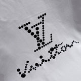 Flat lay presentation of Louis Vuitton cotton t-shirt with logo-detail design
