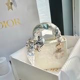 Handle and strap detail of structured signature women's handbag – women's designer-style accessory