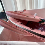 Side view of sleek structured handbag