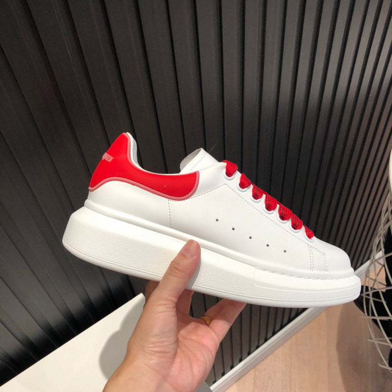 Side profile of Alexander McQueen stone beige sneakers classic court silhouette