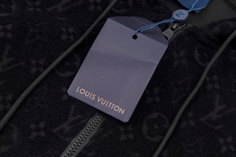 Flat lay presentation of Louis Vuitton luxury clothing with everyday silhouette