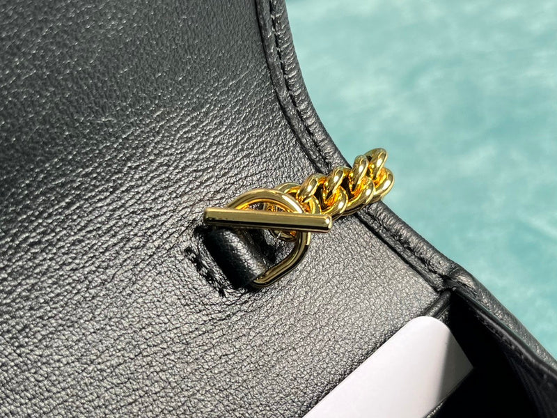Close-up detail of polished classic women's handbag – women's luxury handbag