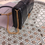 Handle and strap detail of structured modern women's handbag – women's luxury accessory
