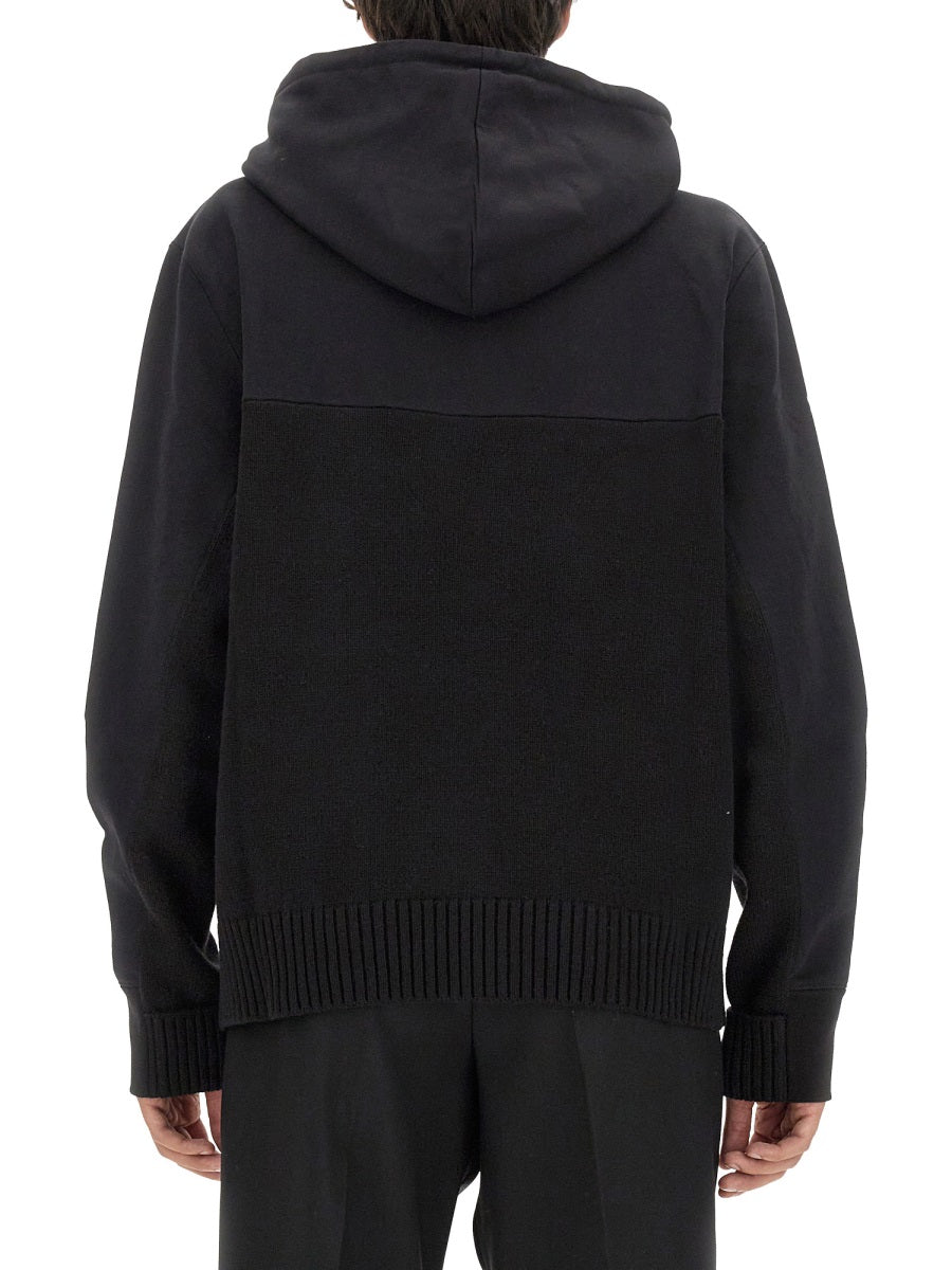 Close-up of Alexander McQueen sweaters & pullovers hardware and fine stitching