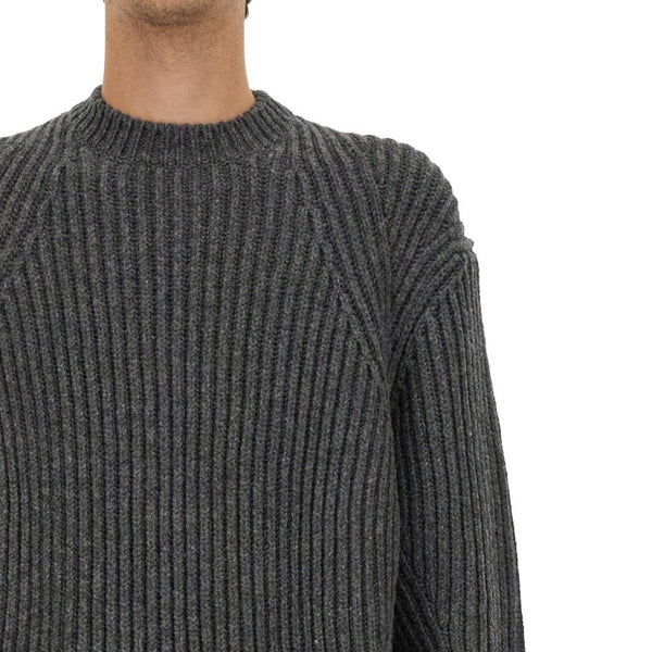 Close-up of Alexander McQueen sweaters & pullovers hardware and fine stitching