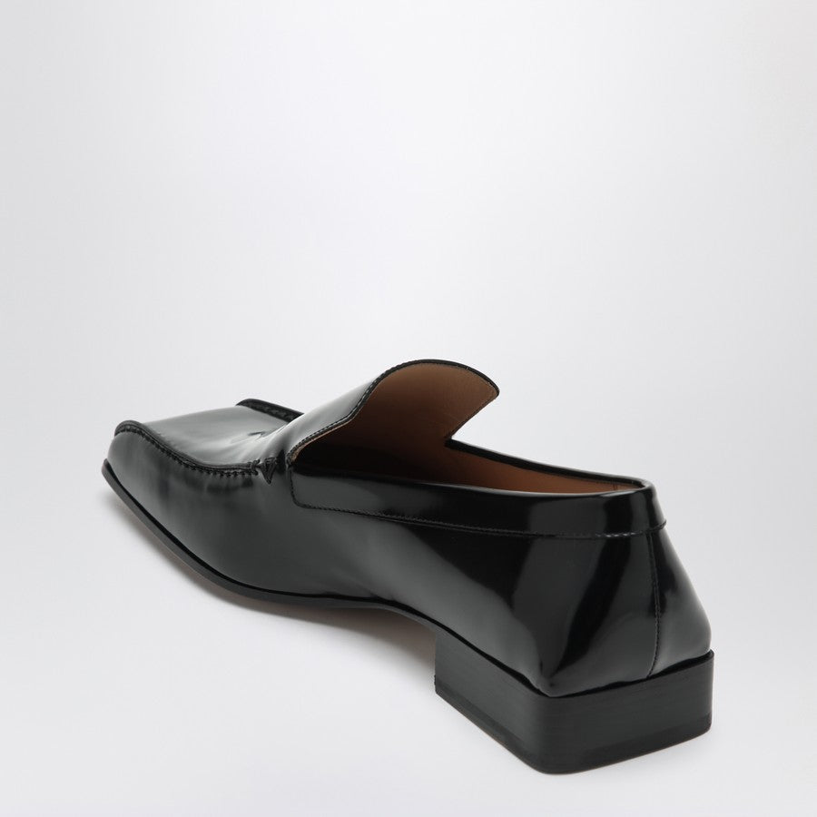 Close-up of Bottega Veneta flats hardware and fine stitching