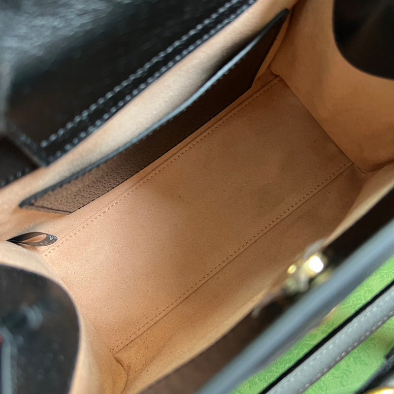 Close-up detail of modern elevated women's handbag – women's designer-style accessory