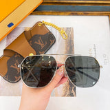 Lifestyle view of Louis Vuitton unisex sunglasses