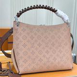  Signature shoulder bag carried on shoulder