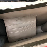 Side profile of statement polished women's handbag – women's statement bag