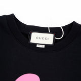 Close-up detail shot of Gucci luxury clothing with relaxed-fit cut