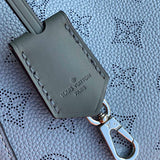 Handle and strap detail of statement elevated women's handbag – women's designer-style accessory