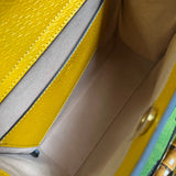 Side profile of statement signature women's handbag – women's luxury accessory