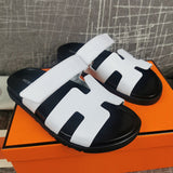 Hermès Black Slide Sandals - Full Silhouette View
