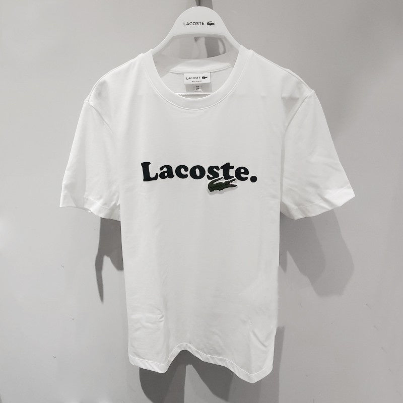 Side profile of Lacoste luxury clothing with signature branding