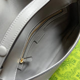 Side profile of refined sleek women's handbag – women's luxury accessory