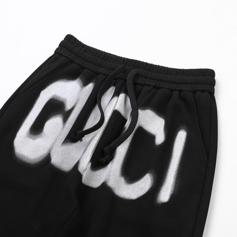 Close-up detail shot of Gucci luxury clothing with monogram-inspired silhouette