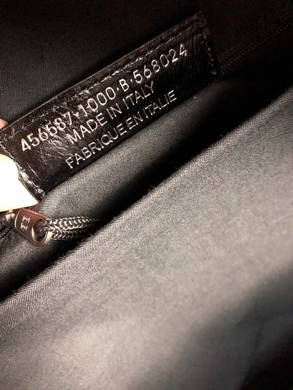 Close-up detail of sleek statement women's handbag – women's luxury accessory