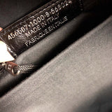 Close-up detail of sleek statement women's handbag – women's luxury accessory