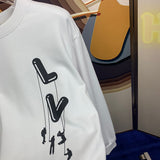 Front view of Louis Vuitton luxury clothing with tailored silhouette