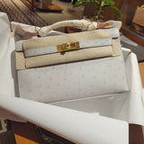 Side view of sculpted structured handbag