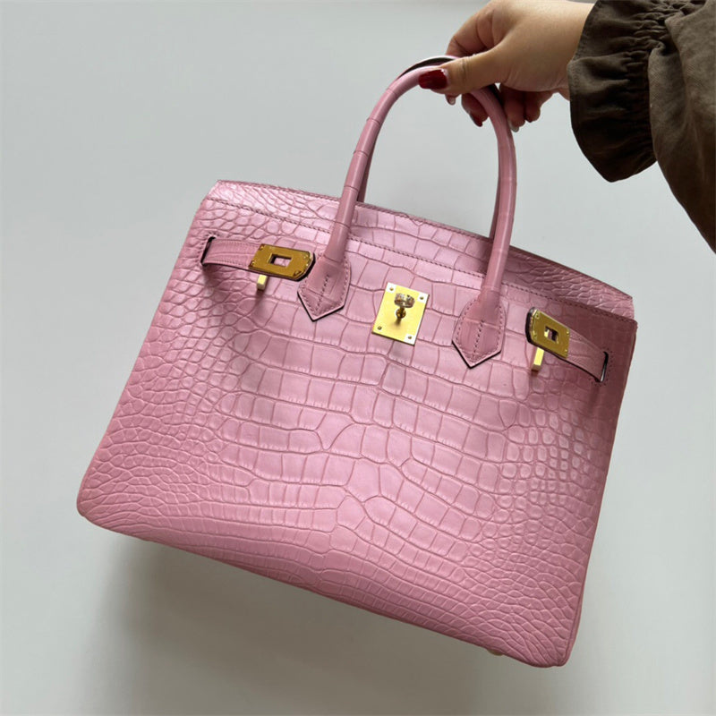 Side view of refined structured handbag
