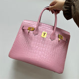 Side view of refined structured handbag
