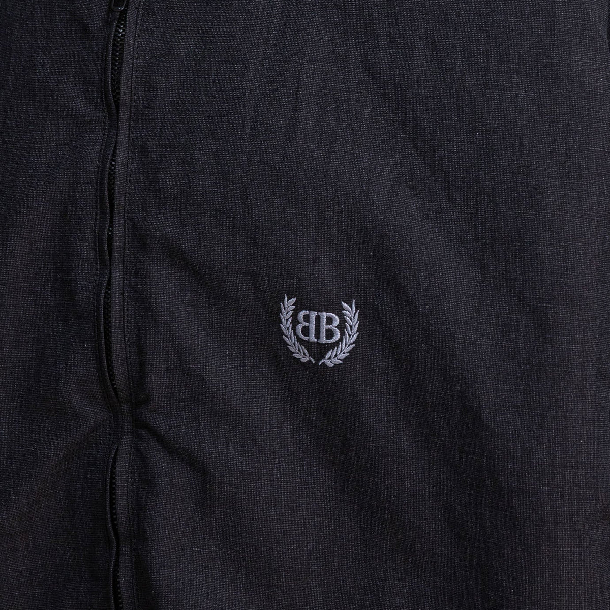 Close-up of Balenciaga outerwear hardware and fine stitching