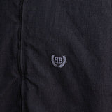 Close-up of Balenciaga outerwear hardware and fine stitching