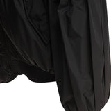 Close-up of Balenciaga outerwear hardware and fine stitching