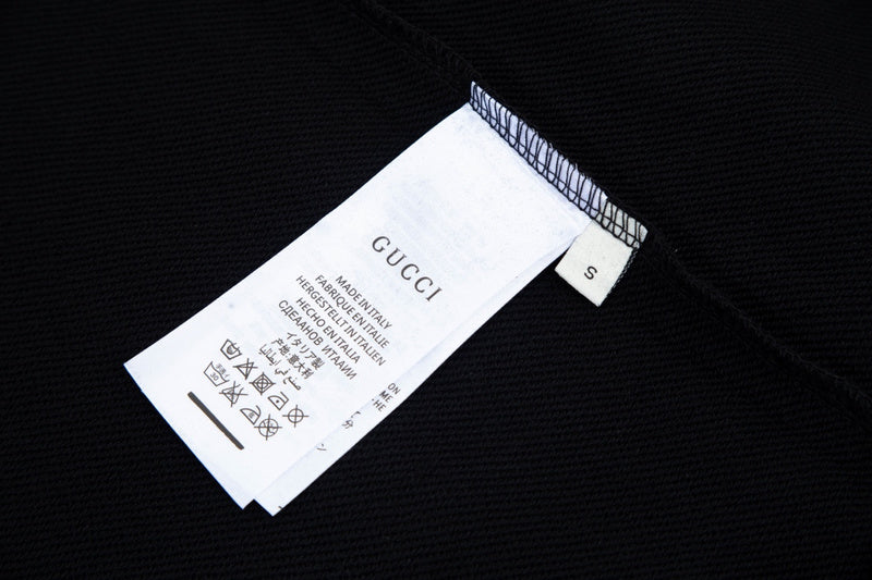 Close-up detail shot of Gucci luxury clothing with everyday silhouette