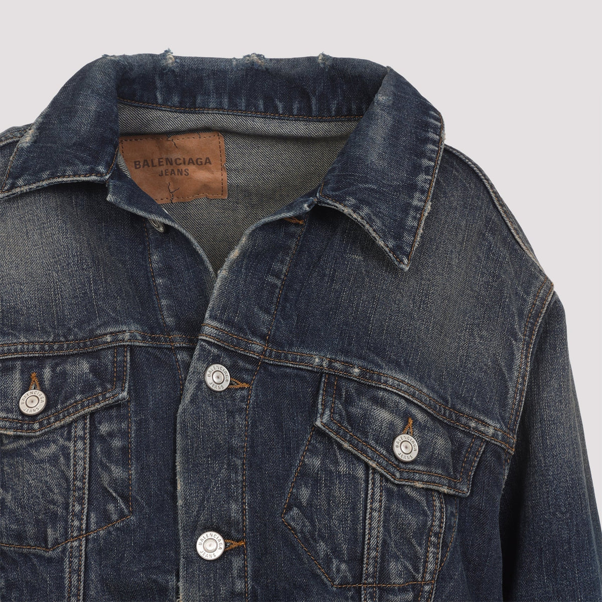 Close-up of Balenciaga outerwear hardware and fine stitching