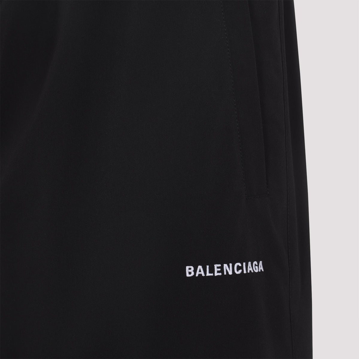 Close-up of Balenciaga pants hardware and fine stitching