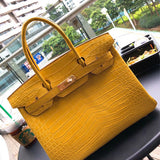 Side view of poised structured handbag