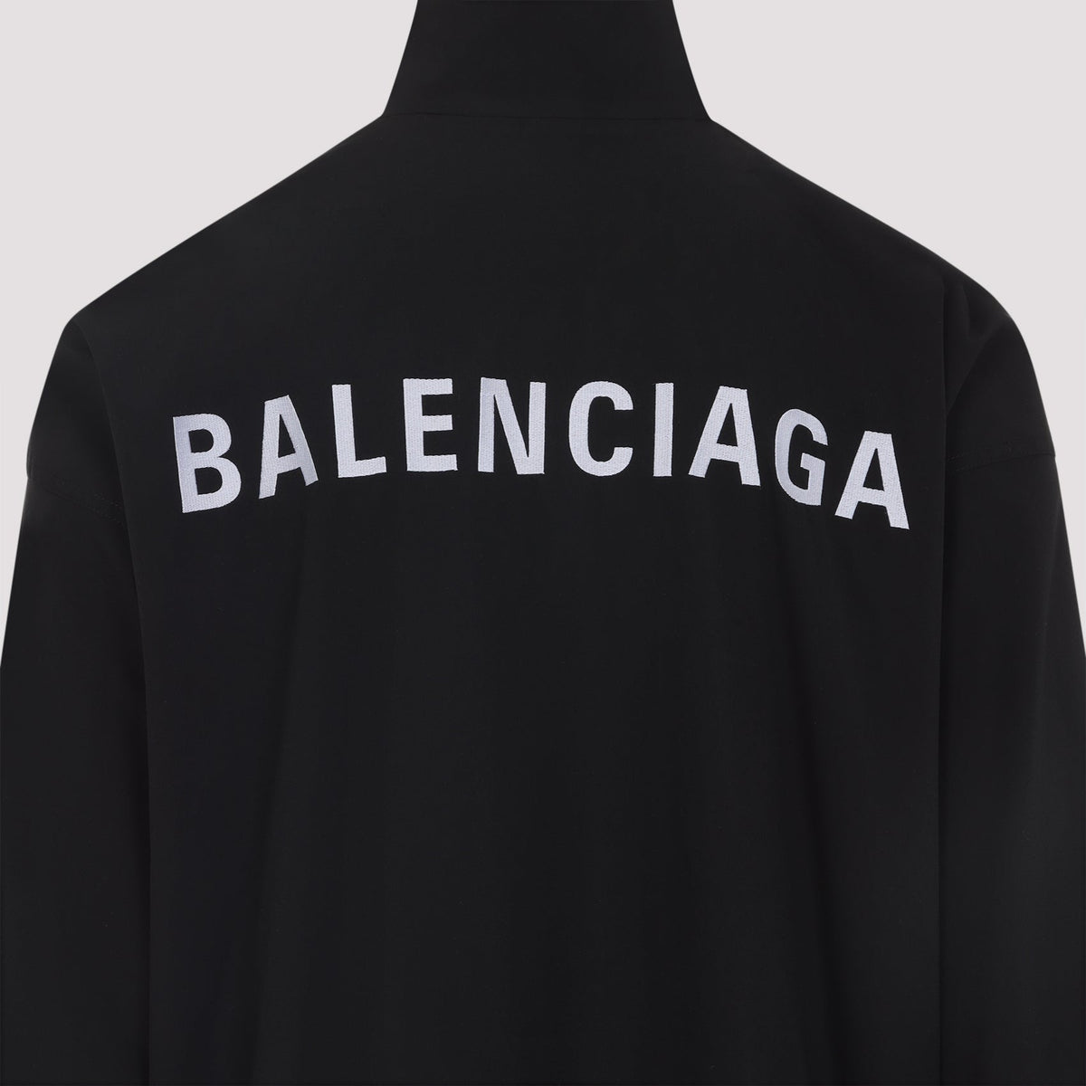 Close-up of Balenciaga outerwear hardware and fine stitching