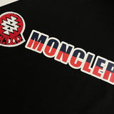 Flat lay presentation of Moncler luxury clothing with contemporary cut