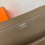 Side view of sleek structured handbag