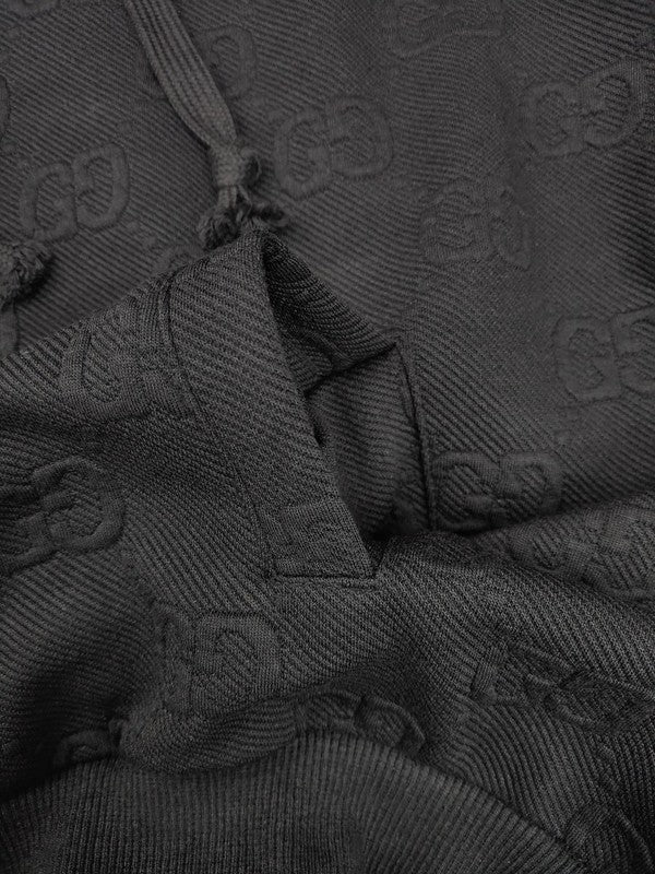 Front view of Gucci luxury clothing with label-forward styling