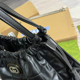 Side profile of polished everyday-luxe women's handbag – women's luxury accessory