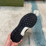 Side profile of Gucci bold contrast sneakers streetwear statement look