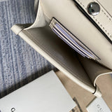 Front view of polished sleek women's handbag – women's statement bag