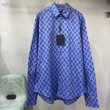 Close-up detail shot of Louis Vuitton luxury clothing with signature branding