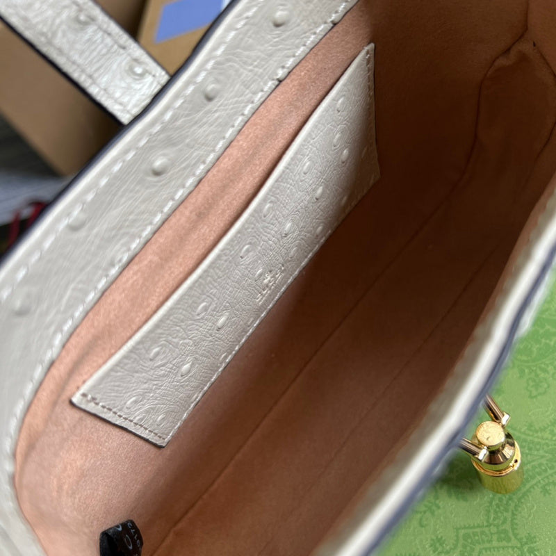 Close-up detail of polished statement women's handbag – women's luxury accessory