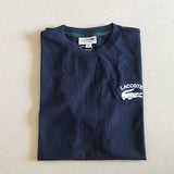 Close-up detail shot of Lacoste luxury clothing with signature branding