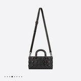 Handle and strap detail of elevated modern women's handbag – women's luxury accessory