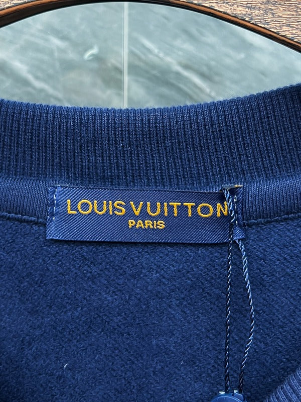 Side profile of Louis Vuitton luxury clothing with tailored silhouette
